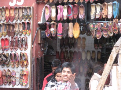 Mojadi is the name of the footwear being sold at this shop, an iconic product of Rajasthan. Despite the fact that we were in a moving van, this young salesman was still intent on our patronizing his business.